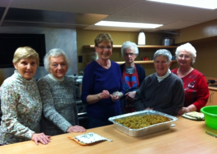 Members of the St. George W.I. in Ontario making a tasty stuffing covered Chicken Pot Pie for the local Lion's Club dinner. It was a big hit with the Lion's! 
